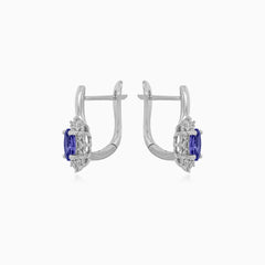White gold tanzanite and diamond halo earrings