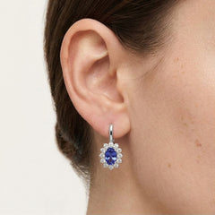 White gold tanzanite and diamond halo earrings