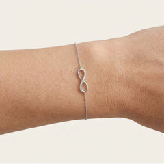 White gold infinity bracelet with diamonds