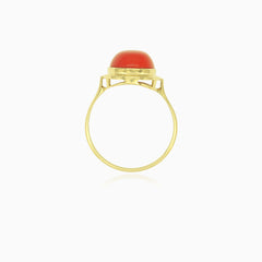 Elegant yellow gold coral cabochon ring