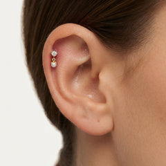 Piercing en or avec perle et zircone