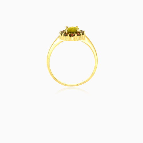Moldavite and garnet ring in yellow gold