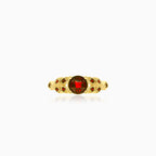 Elegant yellow gold ring with round garnet