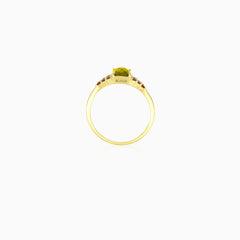 Elegant emerald cut moldavite ring with round garnet