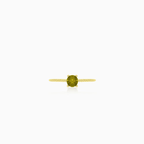 Bague élégante en or avec moldavite taille ronde