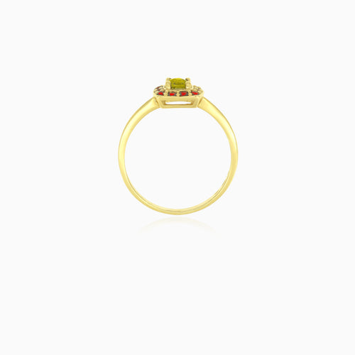 Bague en or jaune avec moldavite ronde et grenat.
