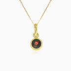 Simple yellow gold pendant with solitaire garnet