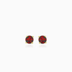 Yellow gold stud earrings with round garnet