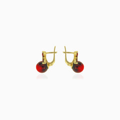 Interesting design yellow gold garnet earrings