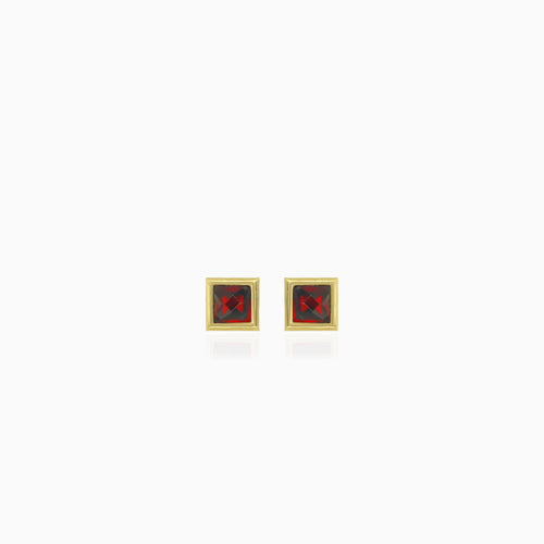 Simple yellow gold stud earrings with solitaire garnet