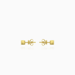 Simple yellow gold stud earrings with solitaire garnet