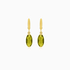 Oval cut modavite in gold earrings