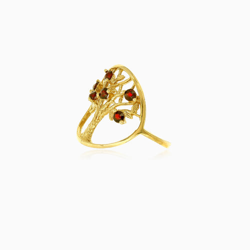 Eleganter Ring mit Lebensbaum und Granat