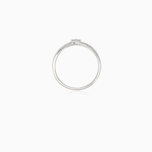 Sparkling white gold engagement ring with unique twist