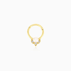 Elegant gold hoop piercing with cubic zirconia and pearl