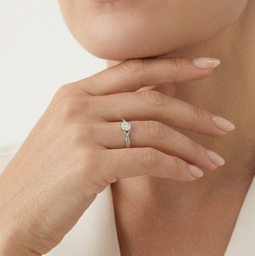 Sparkling white gold engagement ring with unique twist