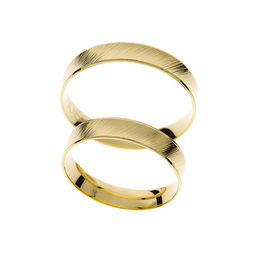 Gelbgoldene, gebogene Ehering.