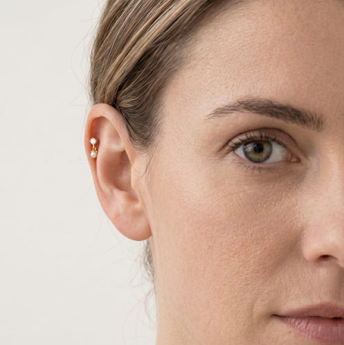 Piercing en or avec perle et zircone