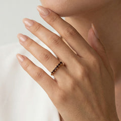 Yellow gold ring with round cut garnets