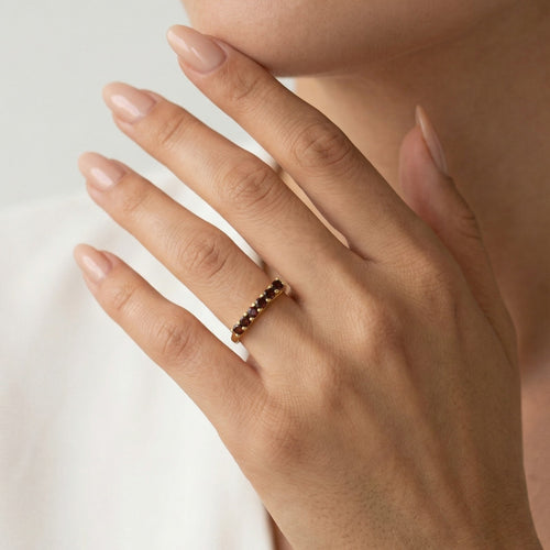 Yellow gold ring with round cut garnets
