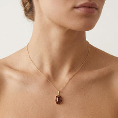 Harmony of shapes gold garnet pendant
