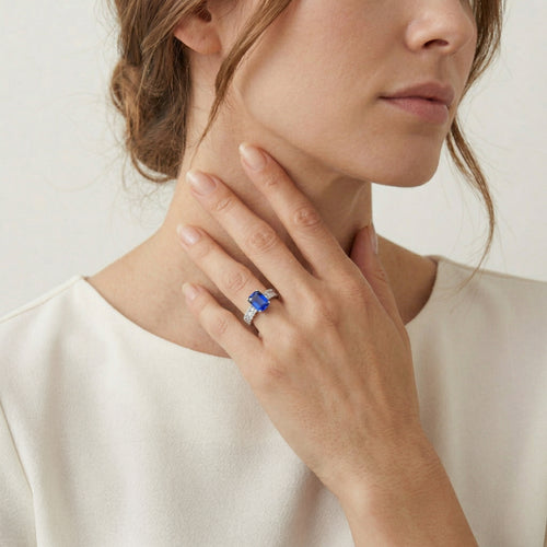 Stylish women's ring with diamonds and blue sapphire