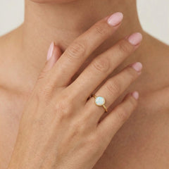 Round white opal gold ring