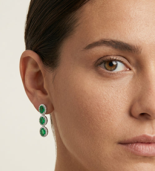 Halo drop earrings with emerald