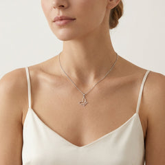 Pendentif papillon en or blanc