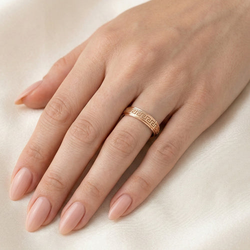 Rose gold wedding ring with greek pattern