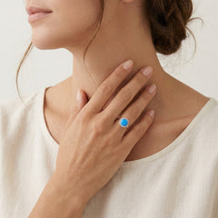 Halo round blue opal ring