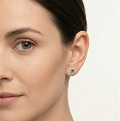Silver earrings with synthetic emerald and surrounding cubic zirconia