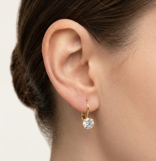 Goldene Hängeohrringe mit vier Krappen