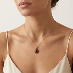 Regal 14kt gold garnet pendant