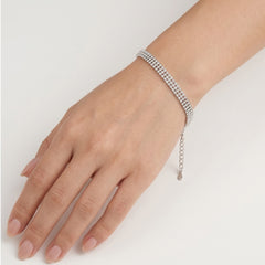 Pulsera tennis de plata con tres líneas de circonitas.