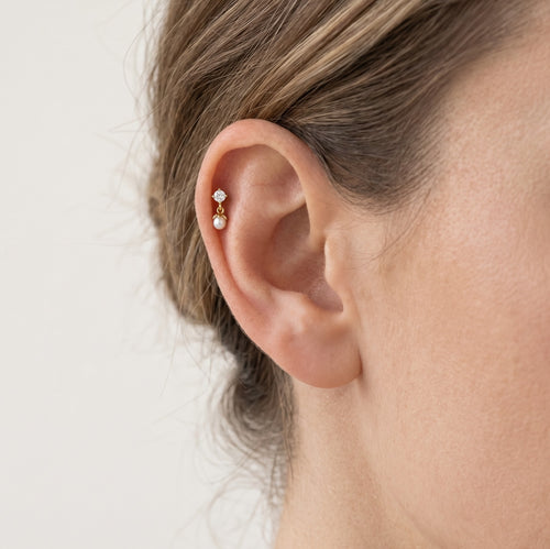 Piercing en or avec perle et zircone