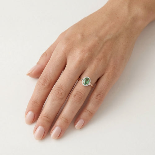 Rose gold ring with green sapphire and diamonds