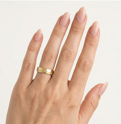 Yellow gold wedding ring with carved line detail