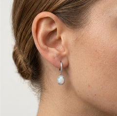 Silver hanging earrings with white opal