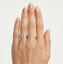 White gold wedding ring with stones on edges