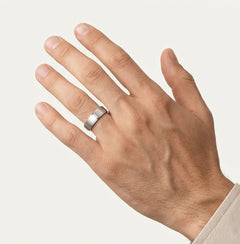 White gold wedding ring with bezel set and baguette stone