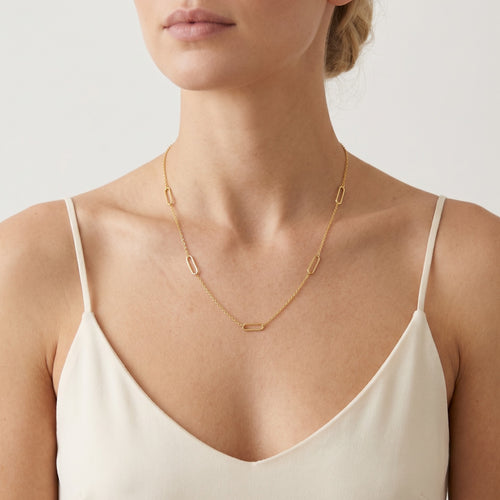 Simple gold necklace with five round rectangles