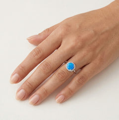 Halo round blue opal ring