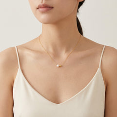 Minimalist gold necklace with a pearl
