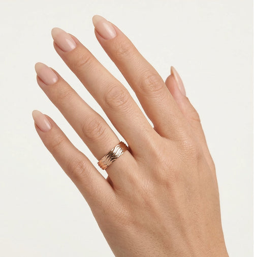 Rose gold wedding ring with wave lines