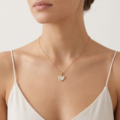 Péndulo de corazón en oro amarillo y blanco