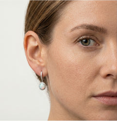 Silver hanging earrings with white opal