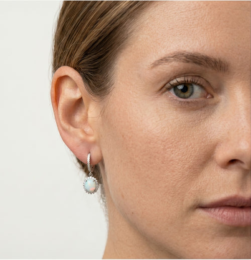 Silver hanging earrings with white opal