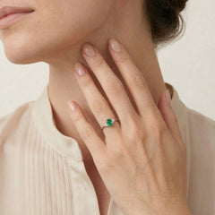 Emerald white gold ring with diamonds