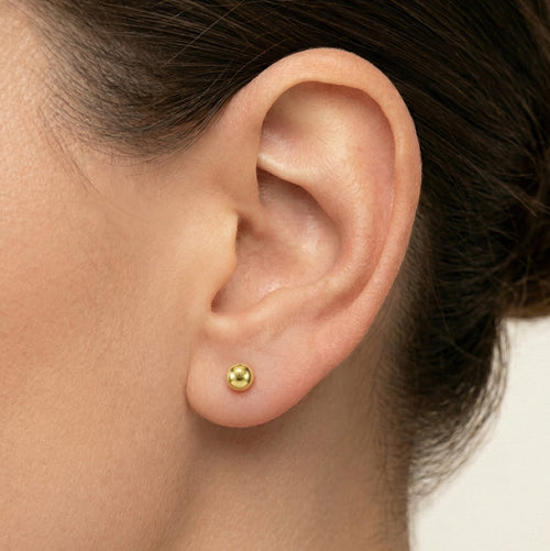 Pendientes de botón en oro amarillo